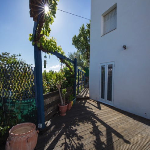Rear decking showing Apartment 1 (Bedroom 1) patio doors